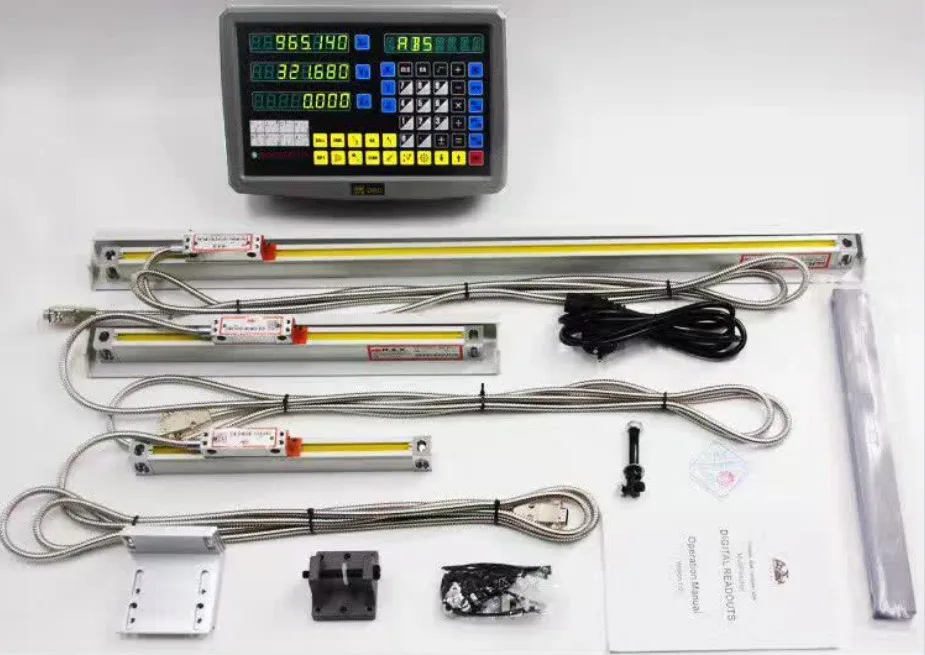 A digital readout and four sealed linear scales laid out with their connecting cables, mounting brackets, a spare part and the operation manual.